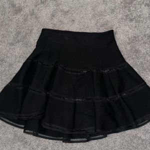 Black flared mini skirt with cut out detailing